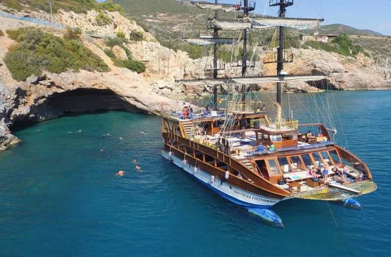 Alanya: Catamaran Boat Tour with Snorkeling with Lunch - Leaving Alanya Harbor with the castle behind you