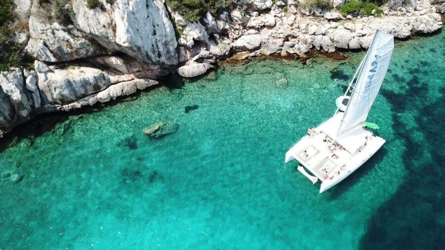 Alghero: Full day on a catamaran in Porto Conte Natural Park - Cala Inferno for snorkeling and swimming