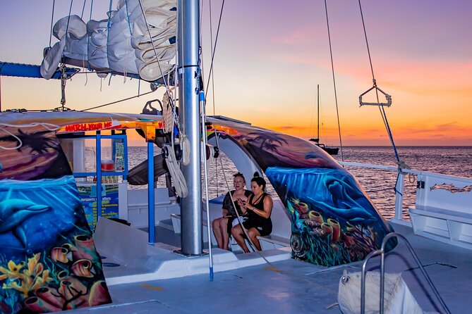 Aruba Sunset Sail Cruise Aboard The Dolphin Catamaran - A two-hour sunset sail with a playful Aruba twist