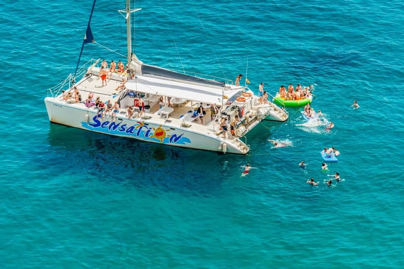 Barcelona: Catamaran Party Cruise with BBQ Meal - Badalona swimming stop and the 30-minute limit