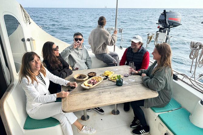 Barcelona Small Group Trip by Catamaran w Tapas, Cava and Sunset - Tapas and cava around Port Vell