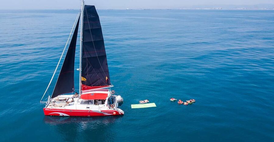 Barcelona: Sunset or Day Catamaran Cruise with Tapa & Drink - Leaving Marina Vela beside Barceloneta