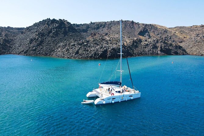 Best of Santorini Private Half-Day Catamaran Cruise with transfer and meal - Red Beach, black rock, and the first swim