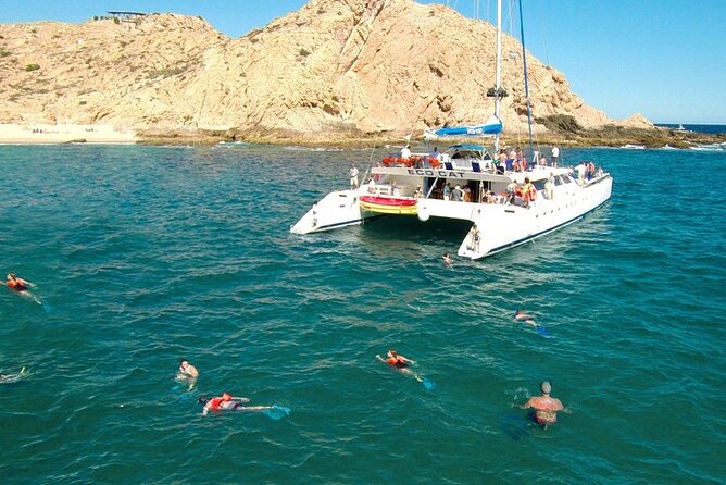 Cabo San Lucas Catamaran Cruise: Snorkel or Sunset Adventure - An open bar and a social boat atmosphere