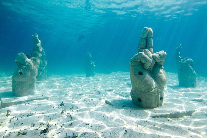 Cancun Half-Day Sailing Catamaran Cruise to Isla Mujeres - Reaching Isla Mujeres and making the most of limited time