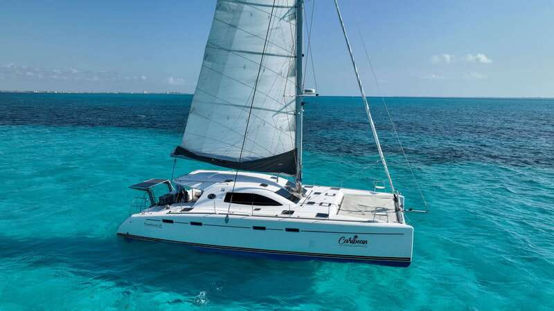 Cancun: Isla Mujeres Catamaran + Coco Bongo Show - Snorkeling at Arrecife El Meco