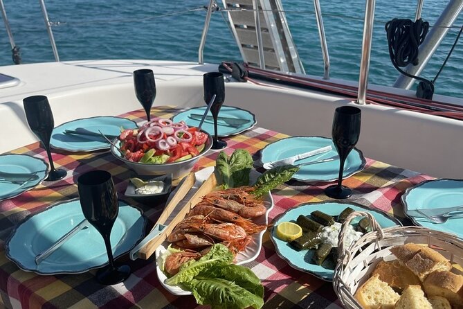 Catamaran cruise in Mykonos with Meal, Drinks & Transport - Pickup, port details, and what to bring
