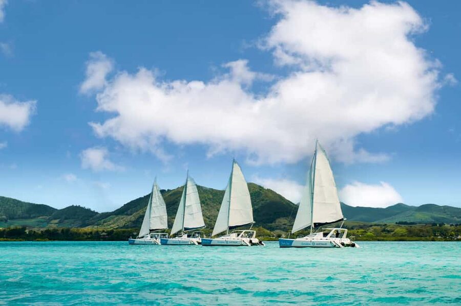Catamaran Cruise to île aux Cerfs w Dolphins watch & Lunch - Sailing along Mauritius’s east coast