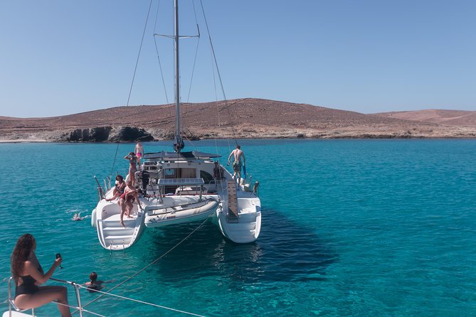 Catamaran Day & Sunset Cruises with meals Drinks and transportation - Pickup from your hotel and departure from Tourlos