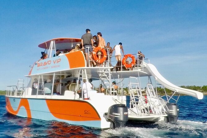 Catamaran Party Cruise with Snorkeling & BBQ - Boarding a catamaran from the beach