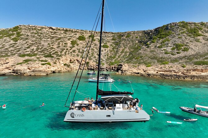 Catamaran Sailing in Palma Mallorca includes Aperitif and BBQ - Cala Vella, swimming, and the onboard BBQ