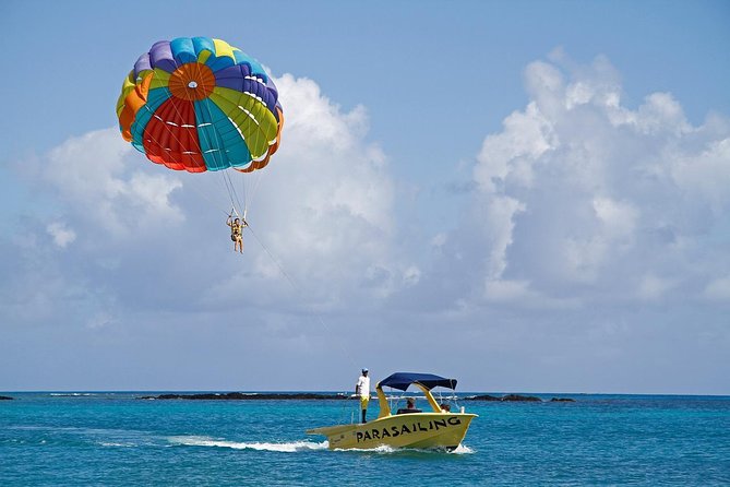 Catamaran to Ile aux Cerf with Parasailing, Tube Riding & Lunch - Tube riding for a faster jolt
