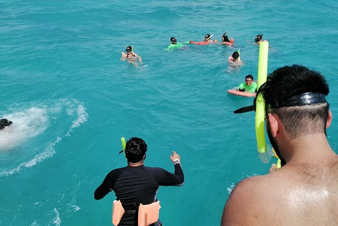 Catamaran to Isla Mujeres at sunset pick up Cancun - Swimming from the boat before Playa Norte