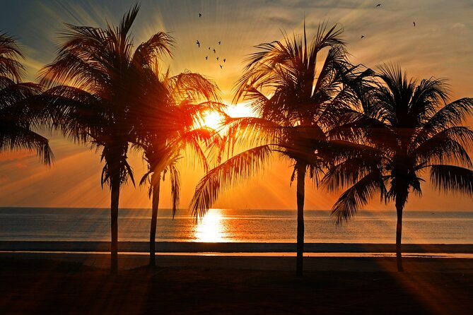 Catamaran to Isla Mujeres at sunset pick up Cancun - A 30-minute crossing from Cancun to Isla Mujeres