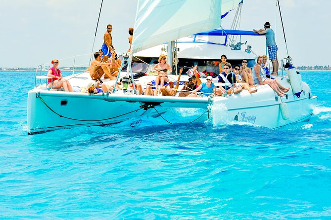 Catamaran to Isla Mujeres Snorkeling Tour with Open Bar and Lunch - Sailing, drinks, and the Spinnaker option