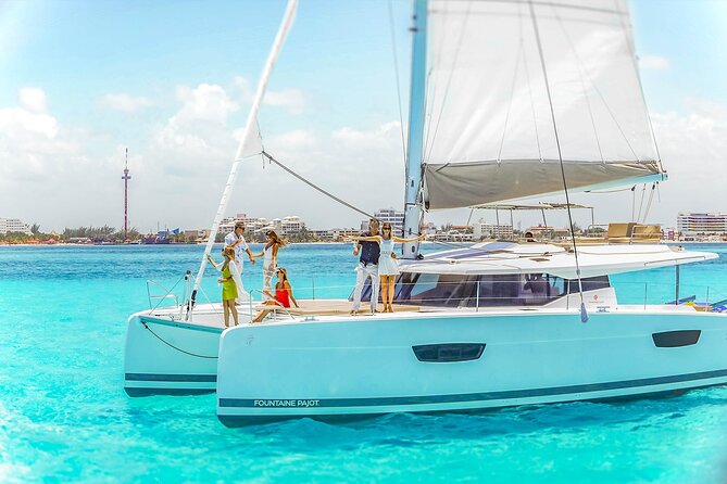 Catamaran to Isla Mujeres Snorkeling Tour with Open Bar and Lunch - Hotel pickup, weather, and cancellation rules