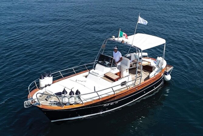 Catamaran tour stops bathing and snorkeling toast with prosecco - Leaving the port with Cagliari behind you