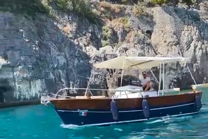 Catamaran tour stops bathing and snorkeling toast with prosecco - Grotta dei Colombi and its darker tale