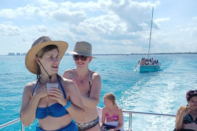 Catamaran Tour to Isla Mujeres all Included - The crew, language, and group atmosphere
