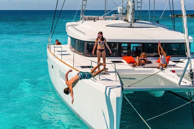 Catamaran Tour to Isla Mujeres from Cancún with Bar and Lunch - Beach club time, lunch, and drinks