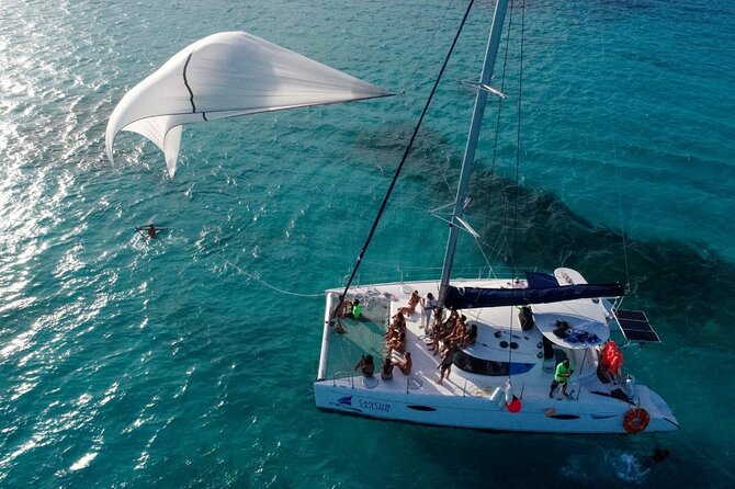 Catamaran Tour to Isla Mujeres, Open bar, Lunch, Snorkeling, Beach Club Included - The First Sailing and the Optional Upgrade Question