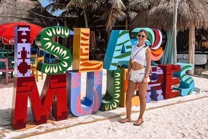 Deluxe Catamaran to Isla Mujeres, with Drinks, Snorkel & Buffet - Unlimited drinks, music, and the boat’s social mood