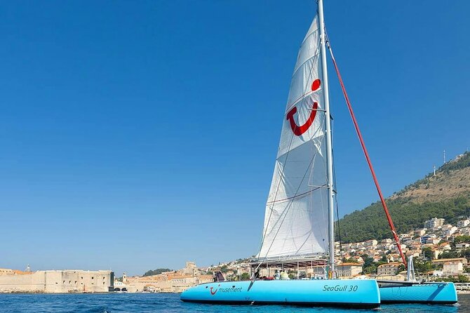 Dubrovnik Sunset Catamaran Cruise with drinks - Old Town walls, harbor views, and Lokrum Island