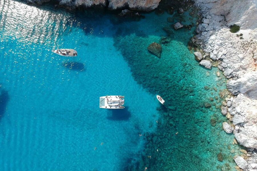 From Adamas: Milos and Poliegos Catamaran Cruise with Lunch - Sykia Cave and the volcanic coast