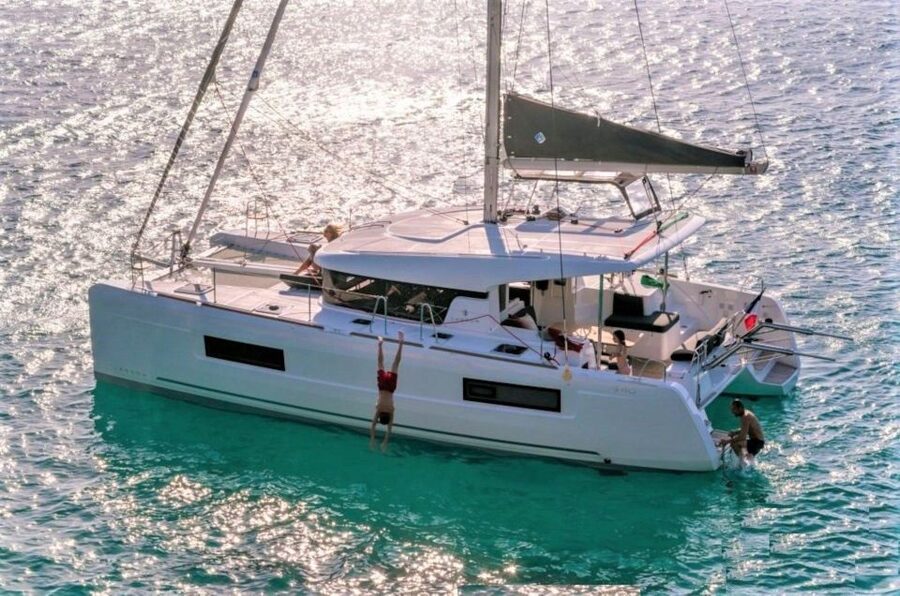 From Cannigione: Catamaran tour in La Maddalena Archipelago - Lunch with fish pasta, Vermentino and Mirto