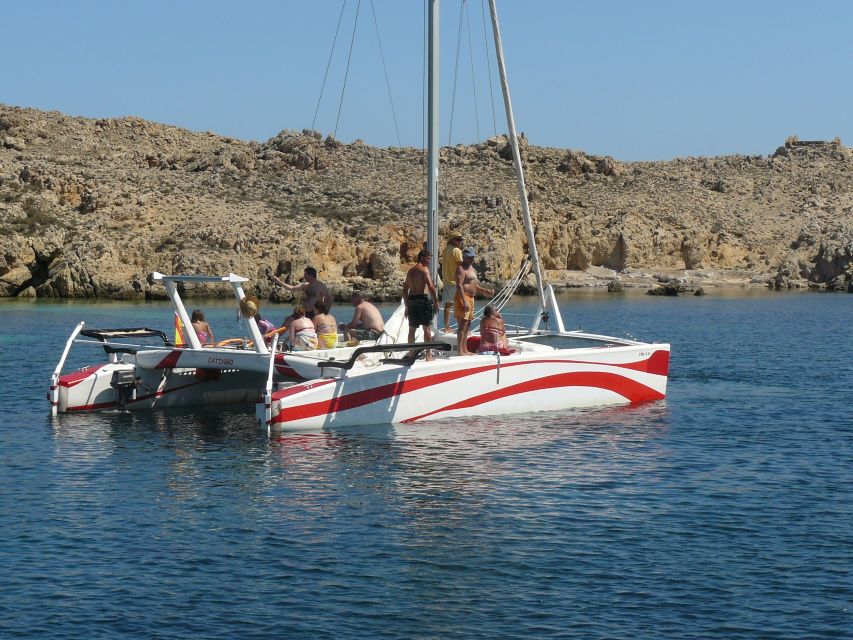 From Fornells: Half-Day Menorca Catamaran Trip w/ Snorkeling - The northern marine reserve from the water