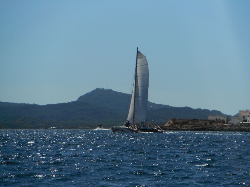 From Fornells: Half-Day Menorca Catamaran Trip w/ Snorkeling - Snorkeling in calm Mediterranean water