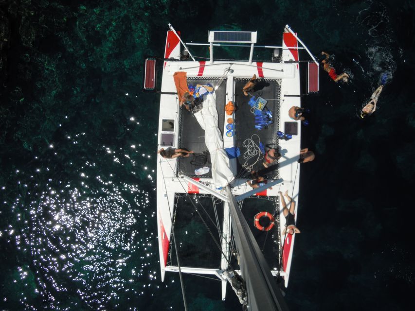 From Fornells: Half-Day Menorca Catamaran Trip w/ Snorkeling - Drinks, snacks, and the practical onboard experience