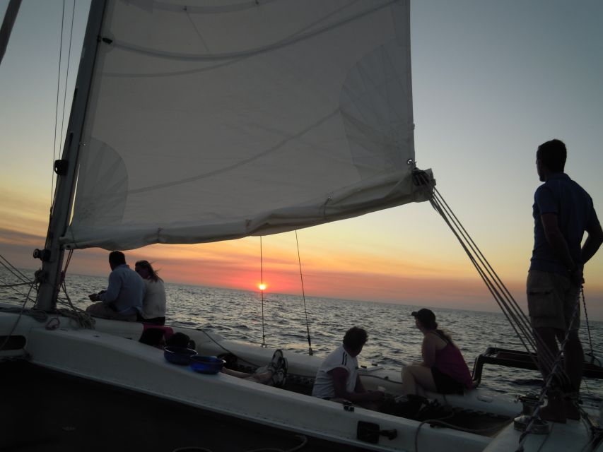 From Fornells: Half-Day Menorca Catamaran Trip w/ Snorkeling - The guide and languages onboard