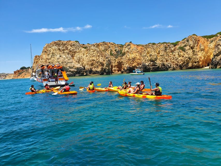 From Lagos: Ponta da Piedade Caves Kayak Tour from Catamaran - The catamaran swim stop and onboard slide