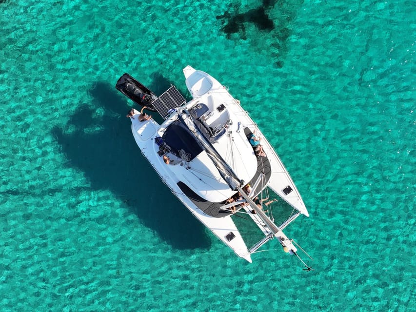 From Ornos: Mykonos Delos Catamaran Cruise with Meal & SUP - The return past Mykonos windmills
