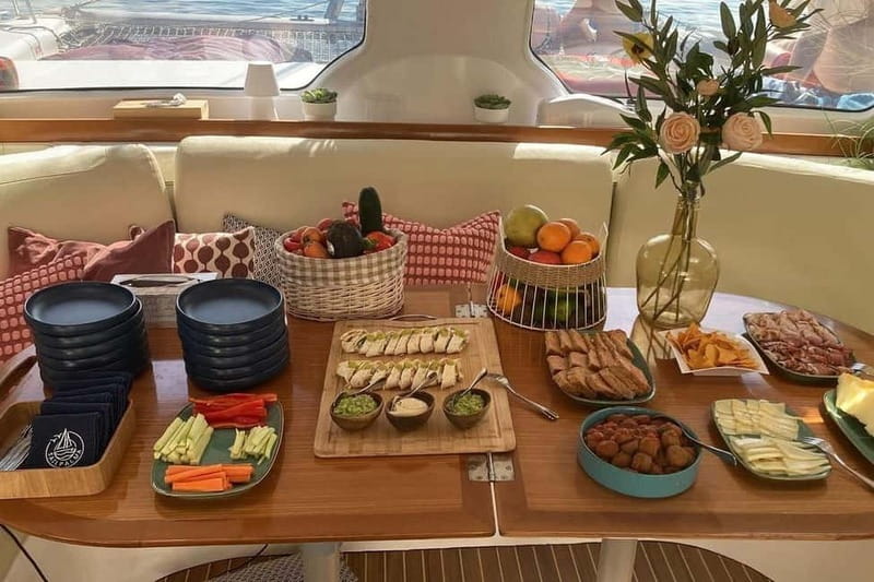 From Palma: Luxury Catamaran Group Tour with Tapas & Drinks - Anchoring in a clear bay