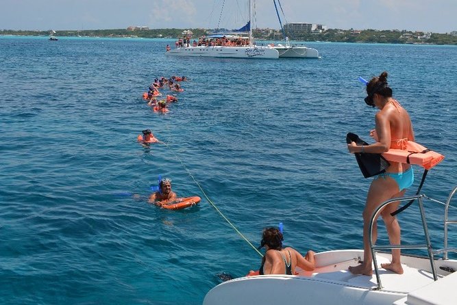 Full-Day Catamaran Tour to Isla Mujeres from Cancun with Lunch - Lunch, drinks, and the social mood