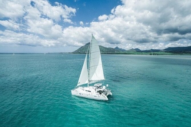 Full Day Shared Tour Catamaran to Ile Aux Cerfs - Sailing across the lagoon toward Ile aux Cerfs