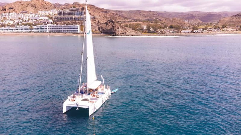 Gran Canaria: Catamaran Tour with Lunch on Pristine Beaches - Caves, cliffs, and a second hour in the water