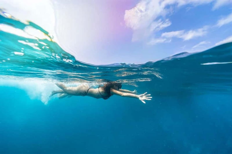 Gran Canaria: Catamaran Tour with Lunch on Pristine Beaches - Paella, fruit, and a drink in your hand