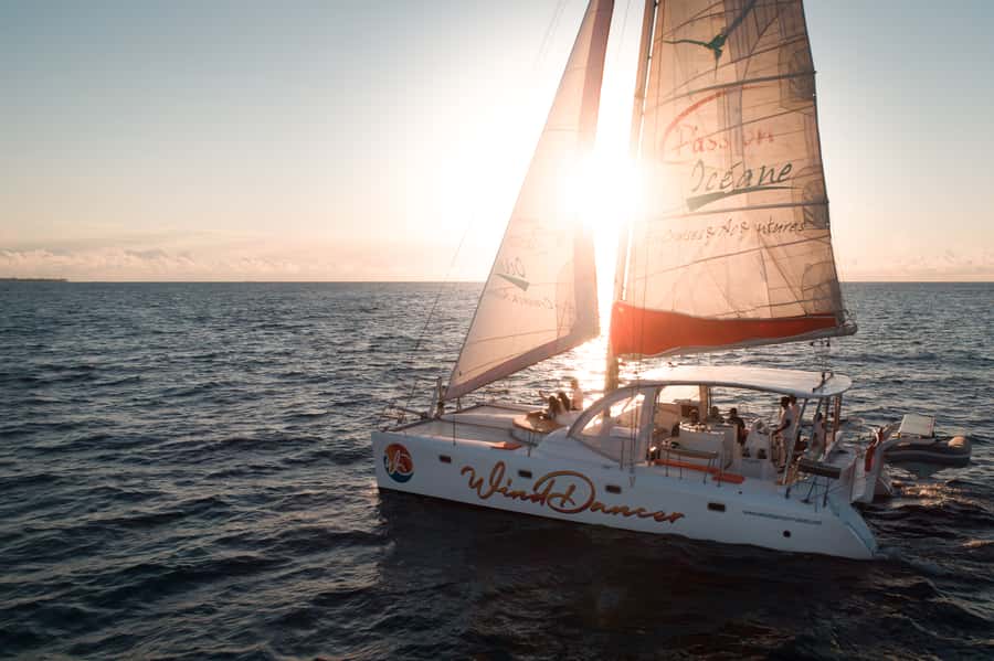 Grand Baie: Cocktail & Sunset Catamaran Cruise - Finding the orange-and-white Wind Dancer