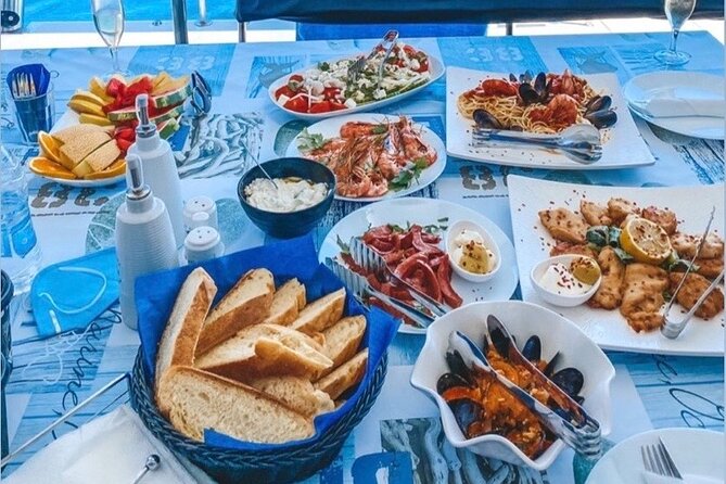 Half-Day Exclusive Catamaran Cruise in Santorini with Meal and Open Bar - What the crew adds to the experience