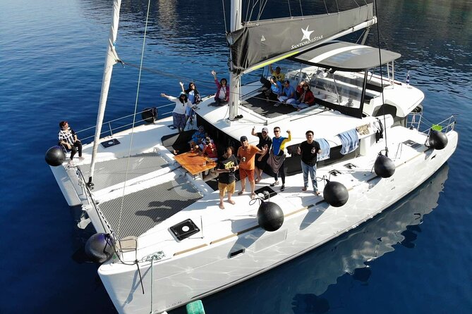 Half-Day Tailor-made Private Catamaran Cruise in Santorini - Swimming in clear water, with a meal on board