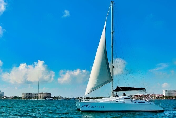 Isla Mujeres Catamaran Sailing Experience with Lunch & Open Bar - Drinks, music, and the return sail