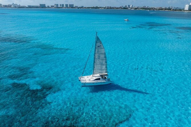 Isla Mujeres Day Tour with Catamaran, Snorkeling & Beach Club - Sailing across Bahia Mujeres