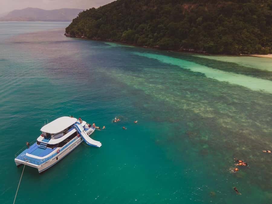 Koh Samui: Koh Tan and Koh Madsum Half-Day Tour by Catamaran - Koh Tan: snorkeling, swimming, and the inflatable slide