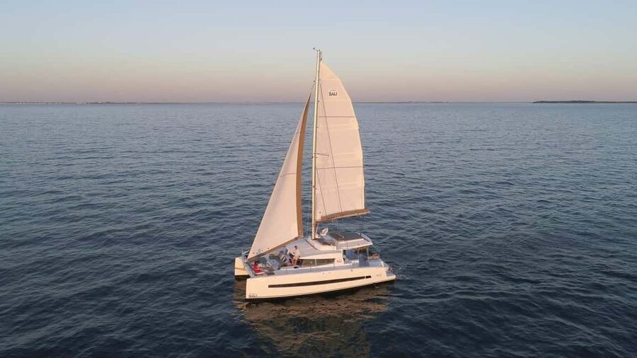 Lagos: Sunset Catamaran Cruise with Welcome Drink - Leaving Lagos for a golden-hour sail