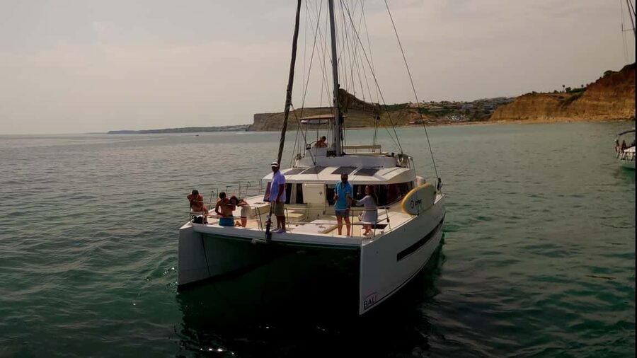 Lagos: Sunset Catamaran Cruise with Welcome Drink - Prainha and the cliffs near Vau