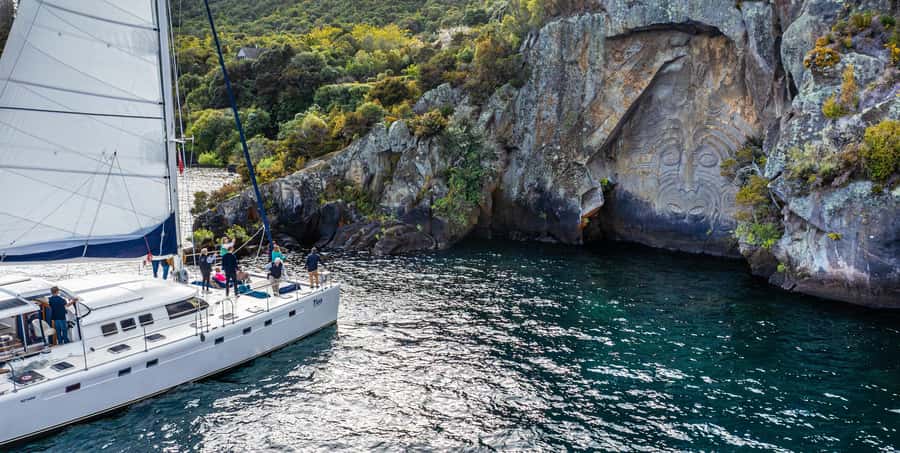 Lake Taupo: Luxury Sailing Catamaran to Māori Rock Carvings - A cold-water swim in a quiet bay