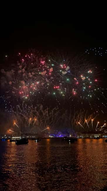 Lisbon: NYE Fireworks Catamaran Cruise with Food & Drinks - The first lights of Lisbon from the Tagus